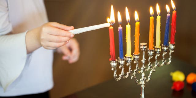 Jewish people around the world observe the holiday with a special Hanukkah menorah, which has nine candle arms.