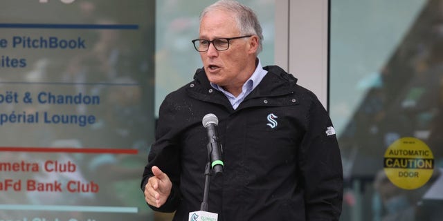 Governor Jay Inslee speaks at the ceremonial ribbon cutting prior to the opening night for the NHL hockey franchise the Seattle Kraken at the Climate Pledge Arena on October 22, 2021 in Seattle, Washington. (Photo by Bruce Bennett/Getty Images)