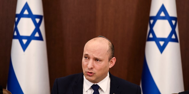 In this Oct. 5, 2021 file photo, Israeli Prime Minister Naftali Bennett speaks at the weekly cabinet meeting in Jerusalem. Iran and world powers resume talks in Vienna this week of Nov. 28, aimed at restoring the nuclear deal that crumbled after the U.S. pulled out three years ago. There are major doubts over whether the deal can be reinstated after years of mounting distrust.