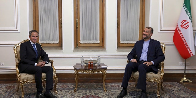 The head of the International Atomic Energy Agency, IAEA, Rafael Mariano Grossi, left, and Iranian Foreign Minister Hossein Amirabdollahian meet, in Tehran, Iran, Tuesday, Nov. 23, 2021. Grossi met Tuesday with Iranian officials to press for greater access in the Islamic Republic ahead of diplomatic talks restarting over Tehran's tattered nuclear deal with world powers.