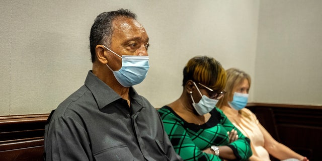 The Rev. Jesse Jackson, sits with Ahmaud Arbery's mother, Wanda Cooper-Jones, during the trial of Greg McMichael, his son, Travis McMichael, and a neighbor, William "Roddie" Bryan in the Glynn County Courthouse, in Brunswick, Georgia, on Nov. 15, 2021. The three are charged with the February 2020 slaying of 25-year-old Ahmaud Arbery. (Stephen B. Morton/Pool via REUTERS)