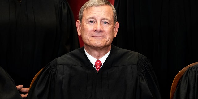 Chief Justice John Roberts sits during a group photo of the Justices at the Supreme Court in Washington, D.C., on April 23, 2021. 