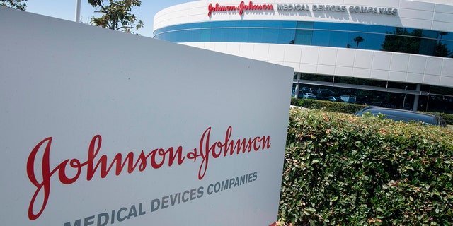 An entry sign to the Johnson &amp; Johnson campus shows its logo in Irvine, California, in August 2019.  The company is facing a lawsuit that is scheduled for trial next year.