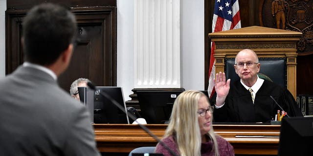 Judge Bruce Schroeder, right, reprimands Assistant District Attorney Thomas Binger, left, in his conduct in line of questioning while cross-examining Kyle Rittenhouse during the trial at the Kenosha County Courthouse on Wednesday.