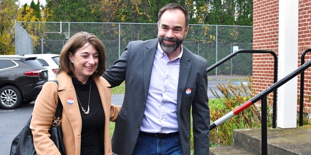 Kevin Brobson, the Republican candidate for an open seat on Pennsylvania's state Supreme Court, leaves with his wife Lauren after they voted at their polling place at Fishing Creek Community Center, Nov. 2, 2021, in Harrisburg, Pa. (AP Photo/Marc Levy)