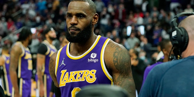 Los Angeles Lakers forward LeBron James is ejected after fouling Detroit Pistons center Isaiah Stewart during the second half of an NBA basketball game, Sunday, Nov. 21, 2021, in Detroit. (AP Photo/Carlos Osorio)