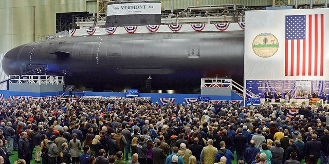 The United States Navy's nuclear-powered attack submarine USS Vermont is christened at Electric Boat in Groton, 康恩, 十月. 20, 2018. Elaine Marie Thomas, 67, of Auburn, 洗。, was the director of metallurgy at a foundry in Tacoma that supplied steel castings used by Navy contractors Electric Boat and Newport News Shipbuilding to make submarine hulls. 
