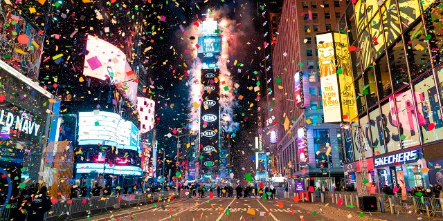On January 1, 2021, on New Year's Eve in New York City, Confetti is flying in the mostly vacant Times Square. - Coronavirus outbreaks have closed Times Square to everyone except a few. (Photo by Corey Sipkin / AFP) (Photo by Corey Sipkin / AFP via Getty Images)