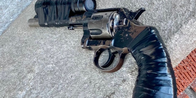 Police recovered a six-shot revolver at the scene.