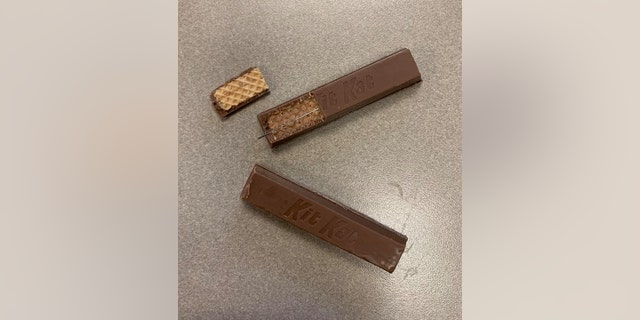 An observant child alerted police in Fostoria to the tampered treats, pictured above with a sewing needle embedded inside the candy.