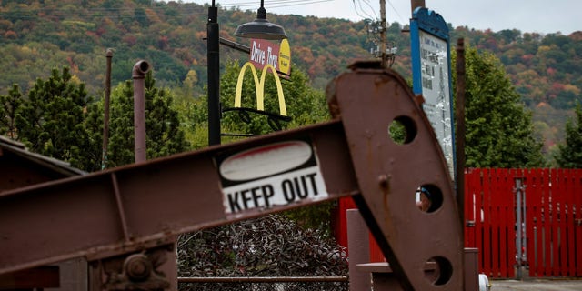 An oil pumpjack operates in the drive-thru of a McDonald's in Bradford, Pennsylvania.