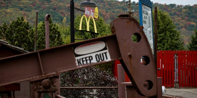 An oil pumpjack operates in the drive-thru area of a McDonald's in Bradford, Pennsylvania, U.S. October 6, 2017. REUTERS/Brendan McDermid