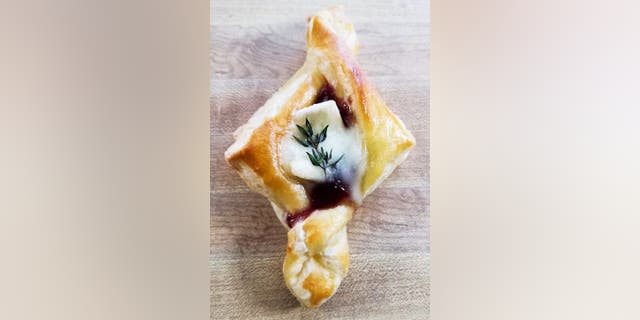 Trendgredient's cranberry brie tarts are made with fruit jam or sauce, cheese, eggs and thyme.