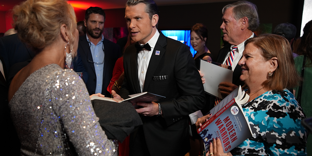 Pete Hegseth signs copies of his book ‘Modern Warriors’ at the Patriot Awards 