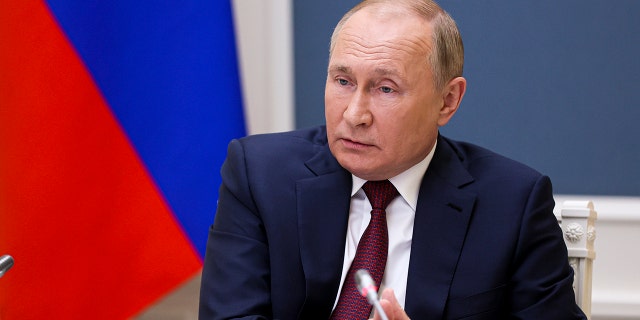 Russian President Vladimir Putin attends a video call of the VTB Capital "Russia Calling!" Investment Forum in Moscow, Russia, Tuesday, Nov. 30, 2021.