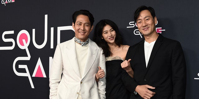 From left, cast members Lee Jung-jae, Jung Hoyeon and Park Hae Soo arrive at a red carpet event for "Squid Game" on Monday, Nov. 8, 2021, at NeueHouse Hollywood in Los Angeles. 