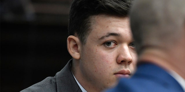 Kyle Rittenhouse listens as Judge Bruce Schroeder talks about how the jury will view video during deliberations in Rittenhouse's trial at the Kenosha County Courthouse in Kenosha, Wisconsin, Nov. 17, 2021. 