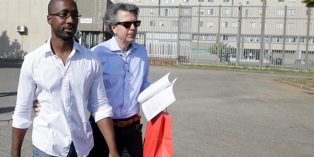 Rudy Guede, 35, left, was convicted of Meredith Kercher's murder along with Amanda Knox and Raffaele Sollecito in 2009 and then released in 2020 after serving 13 years of a 30-year term, according to the Mail. 