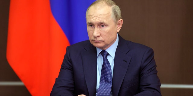 Russian President Vladimir Putin attends a Cabinet meeting via video link in the Black Sea resort of Sochi, Russia, Wednesday, Nov. 24, 2021. 