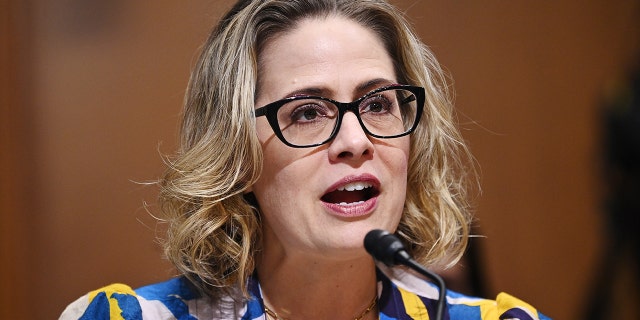 Sen. Kyrsten Sinema speaks during a Senate Finance Committee hearing in Washington on Oct. 19, 2021.