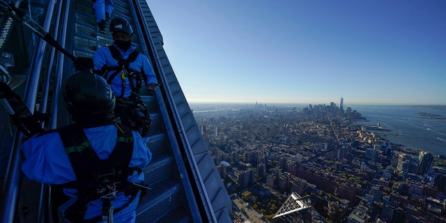 Employees at City Climb escort a group of journalists to the top of the new attraction at 30 Hudson Yards in New York on Nov. 3.