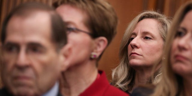 U.S. Representative Abigail Spanberger (D-VA) (back) attends a news conference with fellow Democrats to introduce proposed government reform legislation, which they've titled the For the People Act, at the U.S. Capitol in Washington, U.S. January 4, 2019.  REUTERS/Jonathan Ernst