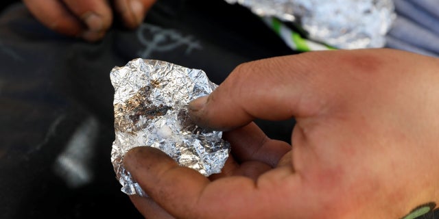 A man living on the streets displays what he says is the synthetic drug fentanyl. REUTERS/Shannon Stapleton