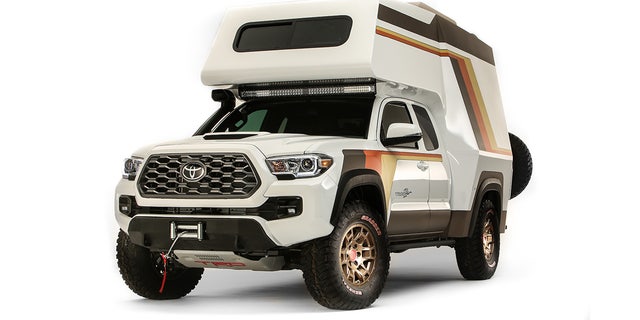 "With tacos" It is a Toyota custom camper van built with the Tacoma.