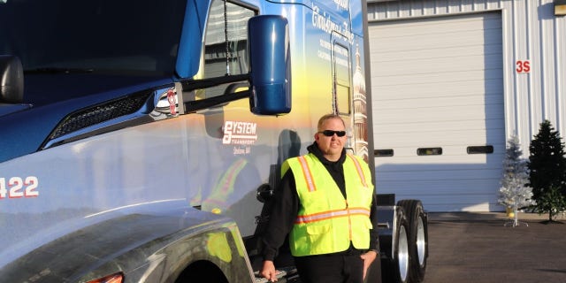 Jeremy Bellinger with the truck transporting the U.S. Capitol Christmas tree.