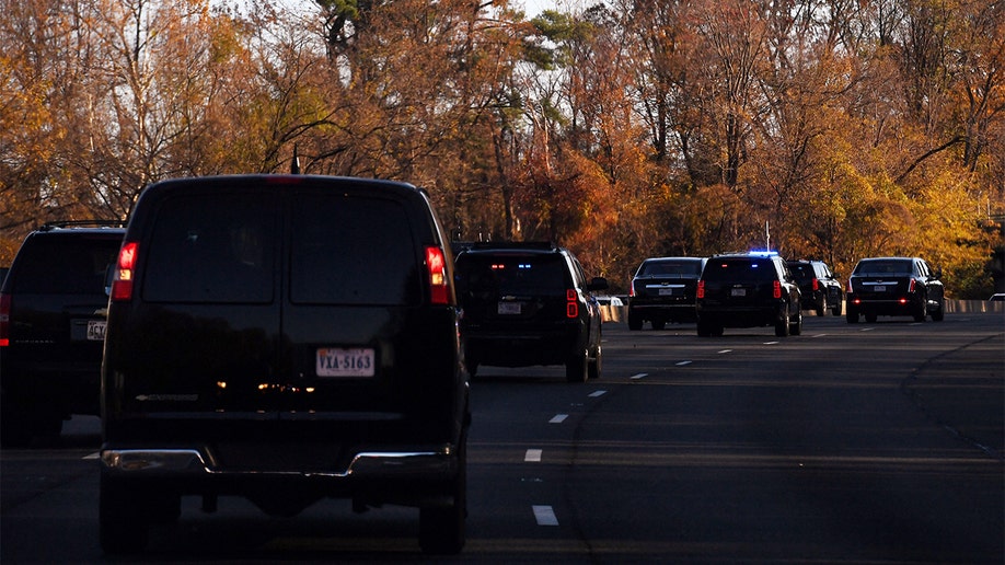 The motorcade carrying President Biden arrives in Bethesda, Maryland