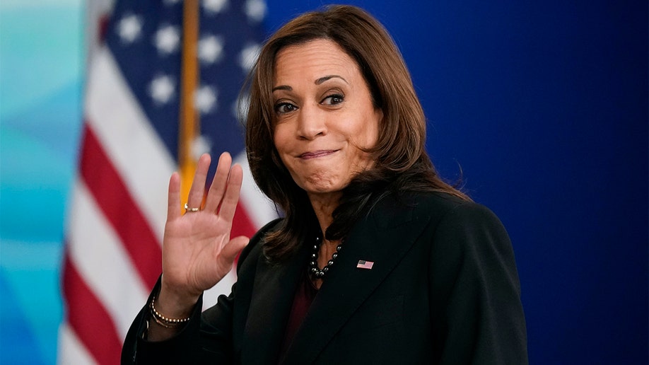 Kamala Harris waves after speaking at the Tribal Nations Summit in the South Court Auditorium on the White House campus