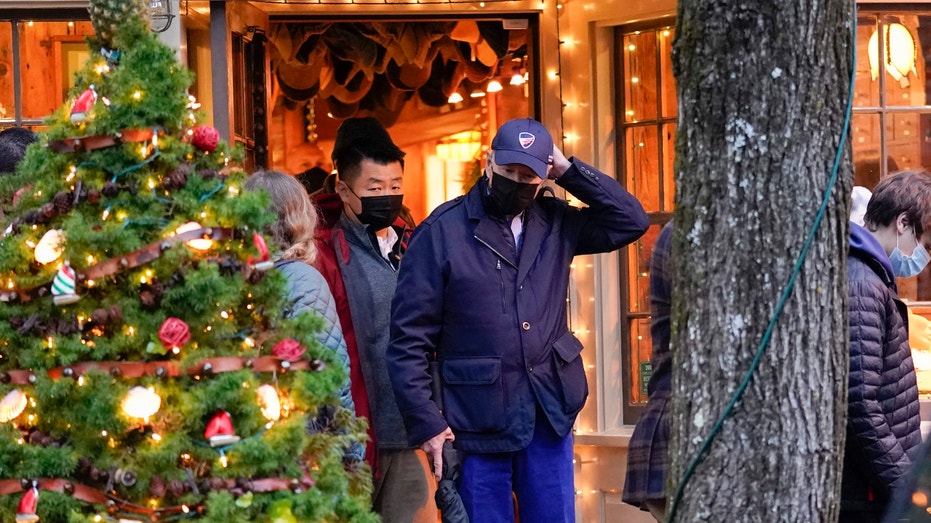 President Joe Biden walks out of a shop as he visits Nantucket, Mass., with family Friday, Nov. 26, 2021. (AP Photo/Carolyn Kaster)