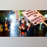 Demonstrators protest in Oakland, Calif., following the acquittal of Kyle Rittenhouse in Kenosha, Wis.