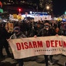 Demonstrators march on the street during a protest against the Kyle Rittenhouse not-guilty verdict near the Barclays Center in New York on November 19, 2021.