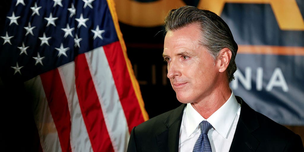 Gavin Newsom roasted for picture of him reading 'banned books' he says states are 'afraid of' - Vimarsana News