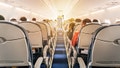 Commercial aircraft cabin with rows of seats down the aisle. morning light in the salon of the airliner. economy class - Fox News