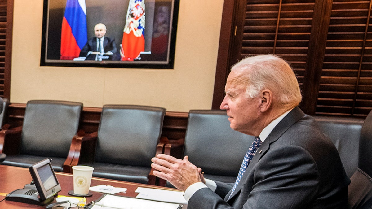 U.S. President Joe Biden holds virtual talks with Russia's President Vladimir Putin amid Western fears that Moscow plans to attack Ukraine, during a secure video call from the Situation Room at the White House in Washington, U.S., December 7, 2021. The White House/Handout via REUTERS.