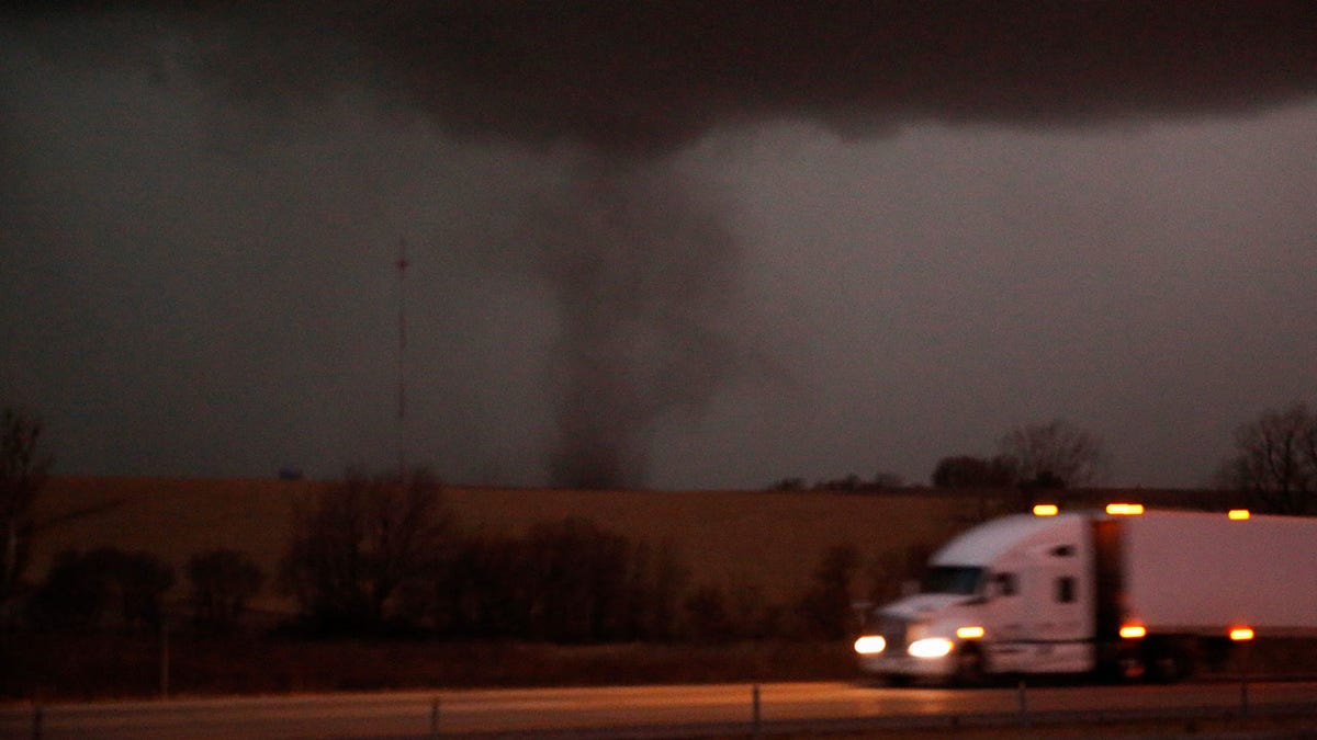 A tornado approaches Interstate 80 near Atlantic, Iowa, as a semi rolls eastward on Wednesday, Dec. 15, 2021. (USA Today Network)