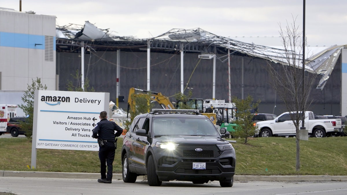 A heavily damaged Amazon fulfillment center is seen Saturday, Dec. 11, 2021, in Edwardsville, Ill. The a large section of the roof of the building was ripped off and walls collapsed when a strong storms moved through area Friday night. (AP Photo/Jeff Roberson)