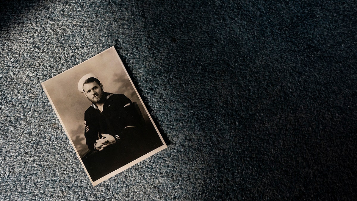 A portrait of Pearl Harbor survivor and World War II Navy veteran David Russell, 101, taken during the war is seen here at his home on Monday, Nov. 22, 2021, in Albany, Ore. (AP Photo/Nathan Howard)