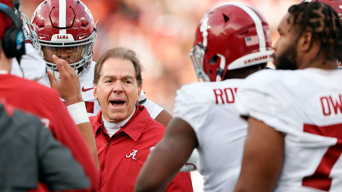 Alabama's Nick Saban talks to his team