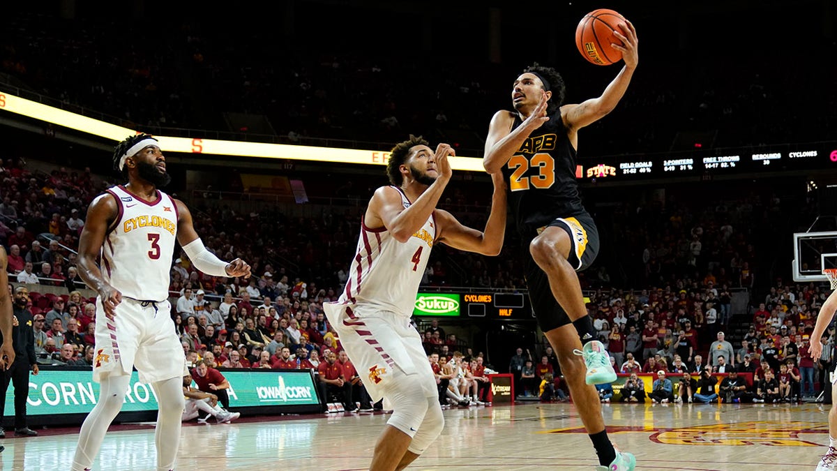 Arkansas-Pine Bluff forward Trey Sampson (23) drives to the basket over Iowa State forward George Conditt IV (4) during the second half of an NCAA college basketball game, Wednesday, Dec. 1, 2021, in Ames, Iowa. Iowa State won 83-64.