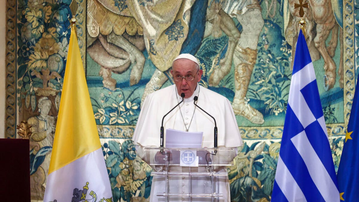 Pope Francis delivers his speech during a meeting with authorities, at the Presidential Palace, in Athens, Saturday, Dec. 4, 2021. Pope Francis arrived to Greece Saturday for the second leg of his trip to the region with meetings in Athens aimed at bolstering recently-mended ties between the Vatican and Orthodox churches. (AP Photo/Yorgos Karahalis, Pool)