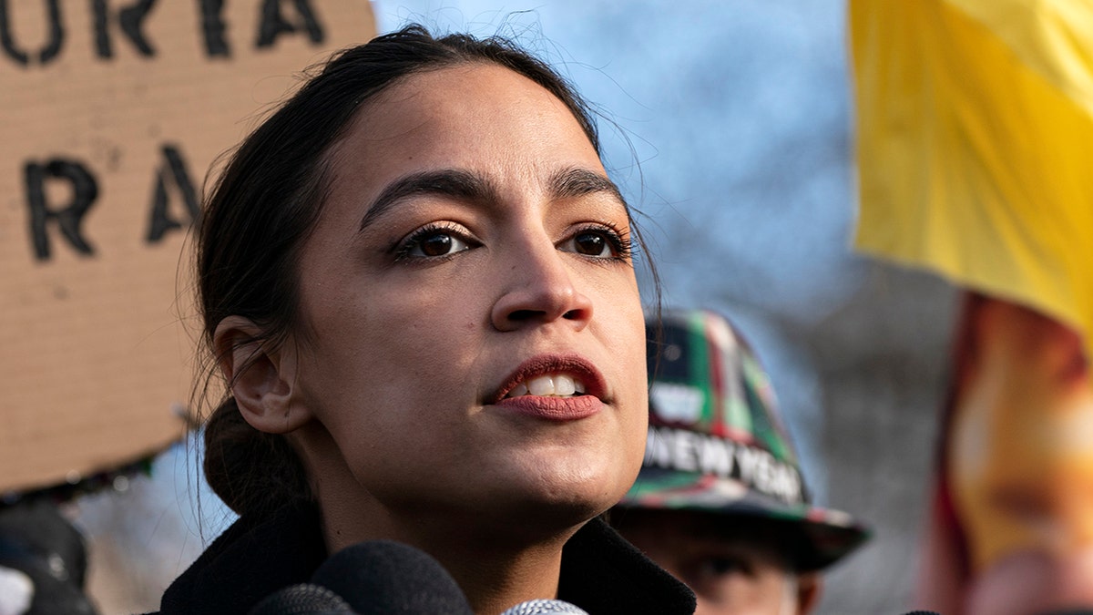 Alexandria Ocasio-Cortez at news conference about pathway to citizenship on Capitol Hill