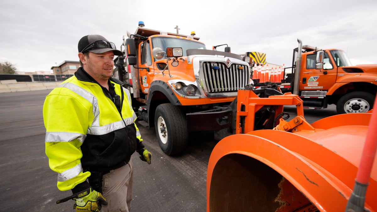As the snow begins to fall, states are having trouble finding enough people willing to take the comparatively low-paying jobs that require a Commercial Driver’s License and often entail working at odd hours in dangerous conditions. (AP Photo/David Zalubowski)