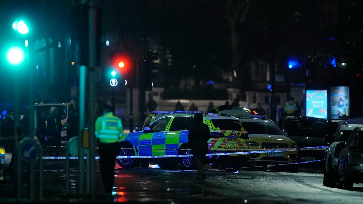 British police say a man has been shot dead during a confrontation with firearms officers near the Kensington Palace royal residence. (Aaron Chown/PA via AP)
