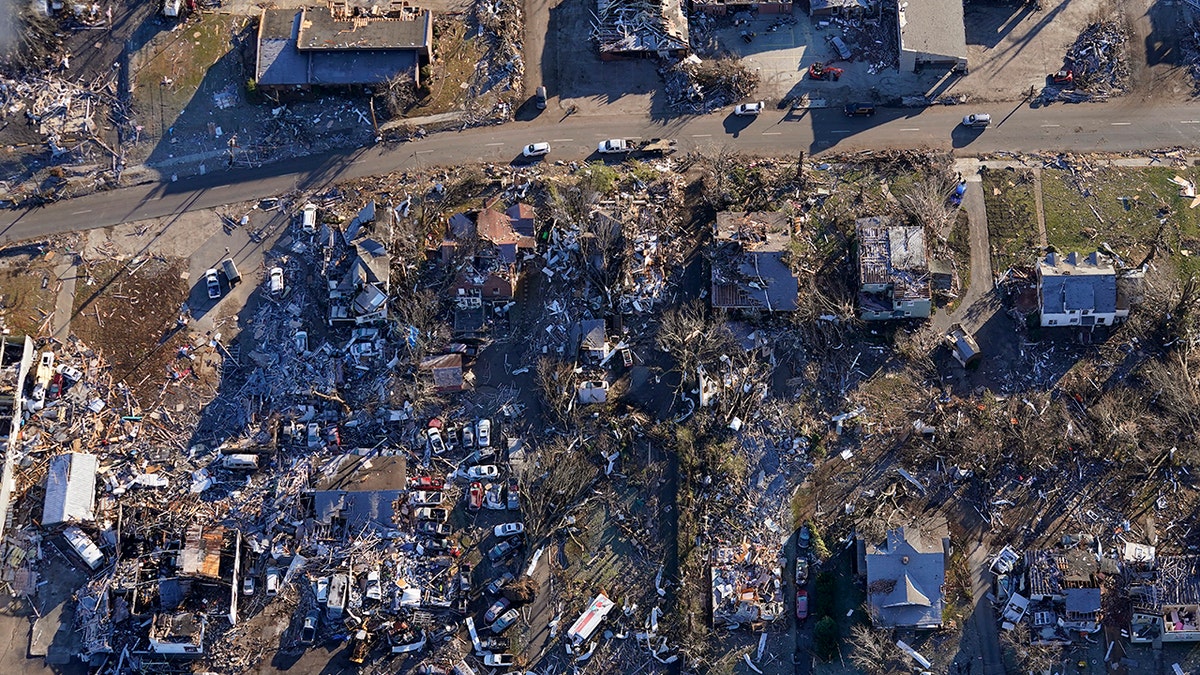 In this aerial photo, destruction from a recent tornado is seen in downtown Mayfield, Ky., Sunday, Dec. 12, 2021. (AP Photo/Gerald Herbert)