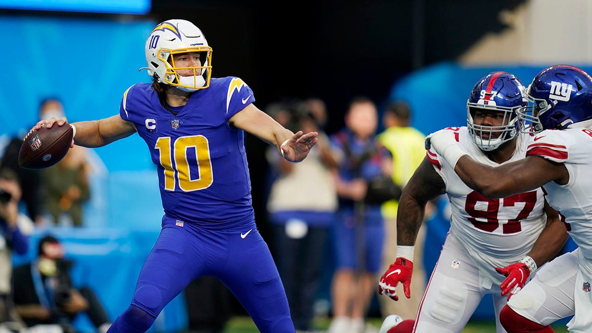 Los Angeles Chargers quarterback Justin Herbert throws against the New York Giants Sunday, Dec. 12, 2021, in Inglewood, California.