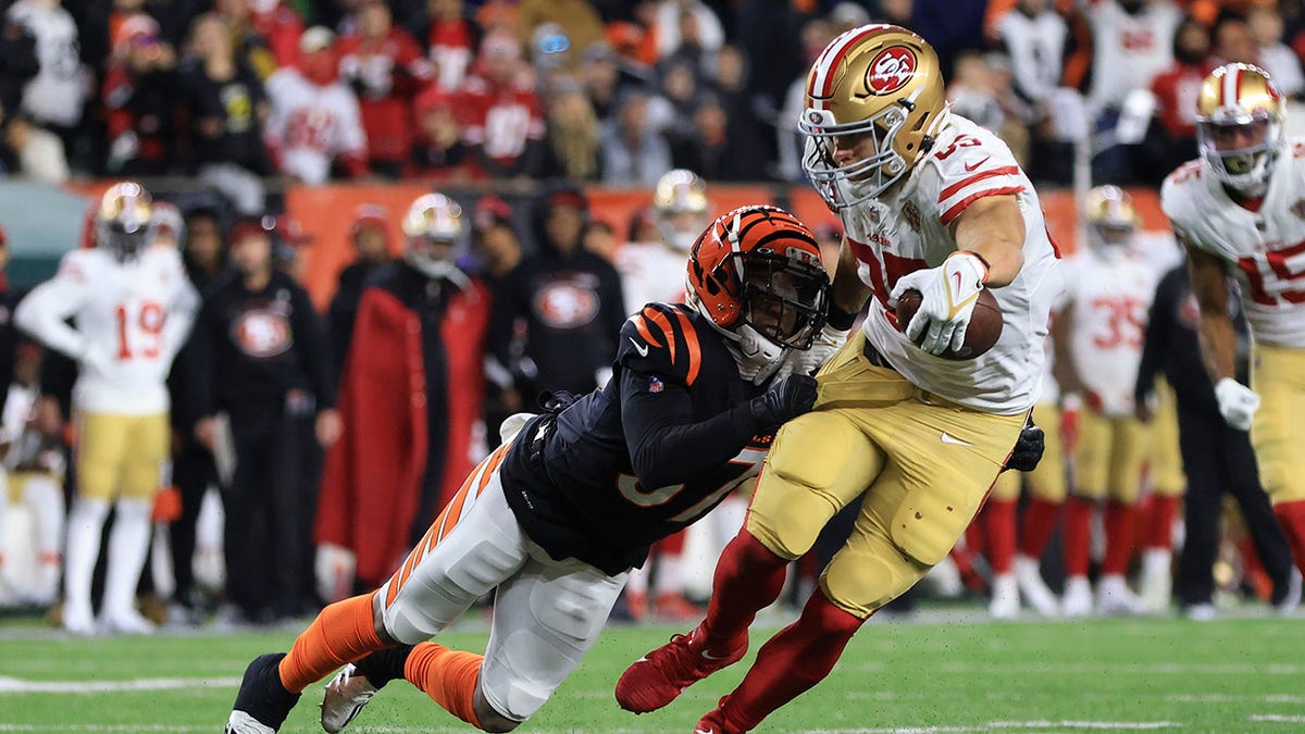 San Francisco 49ers' George Kittle is tackled by Bengals' Ricardo Allen Sunday, Dec. 12, 2021, in Cincinnati.