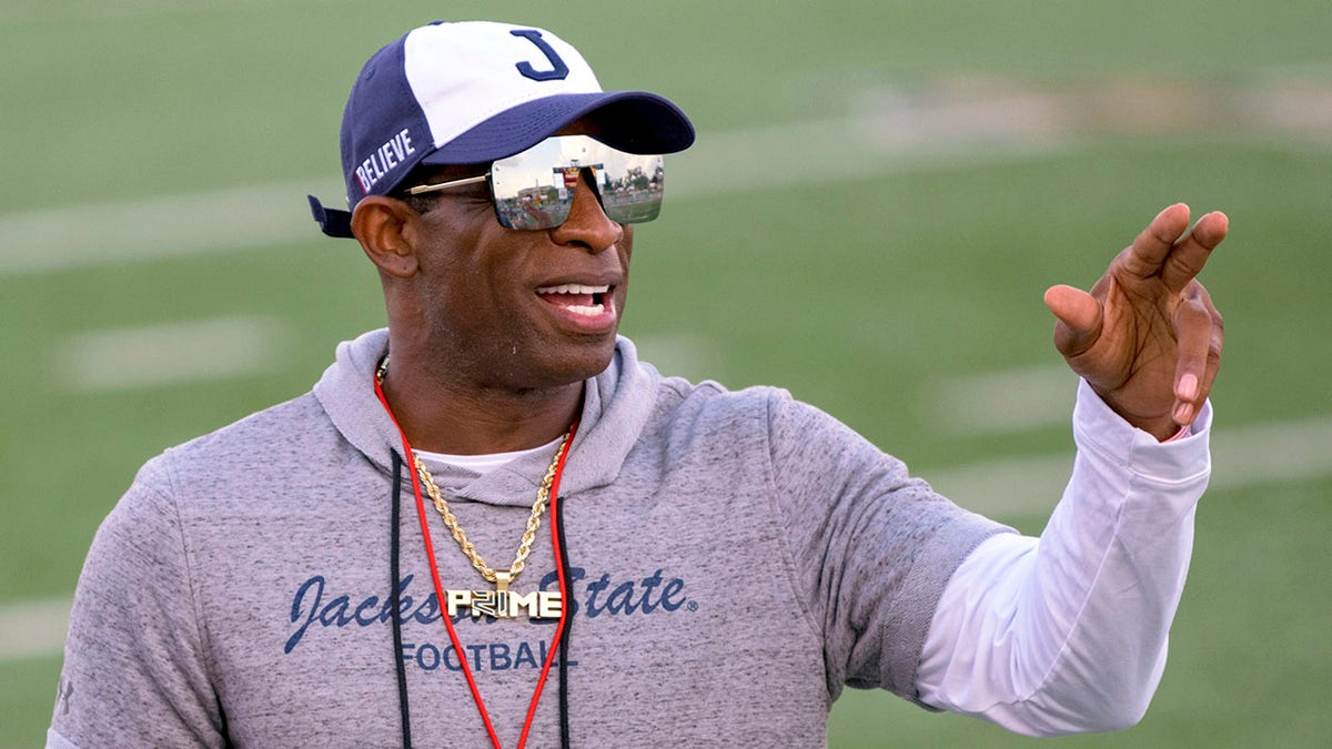 Deion Sanders points during a game